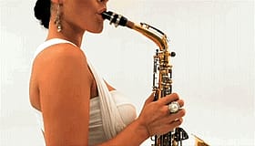 Big Tits Latina Blows a Funky Sax Solo'