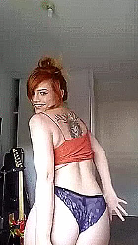 Redhead with Big Tits and Panties: A Sexy, Ass-Kicking Experience'