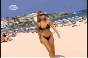 Celebrity Babe in Black Bikini Walking on the Beach'