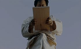 Funny Asian Man Reading Paper'