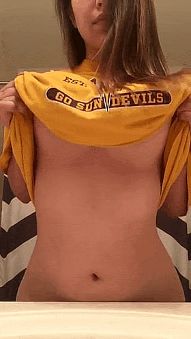 Babes with Big Tits Show Off Their Yellow Go Sun Devils Shirt'