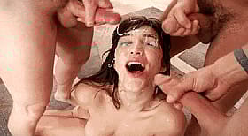 Brunette Teen Gets Bukkake Cumshots from a Gang of Men'