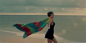Sexy Babe Flaunts Her Rainbow Blanket at the Beach'