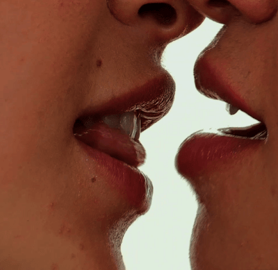 Lesbian Kiss Close Up: Two Girls Locking Lips picture 1 of 1