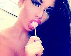 Brunette Lips Licking A Pink Lollypop'