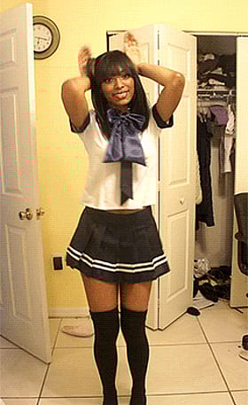 Babes in Black: Ebony Beauty Strikes a Pose in Her Schoolgirl Outfit'