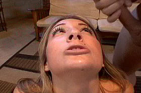 Blonde Pornstar Gets Cumshots from a Gang Bang'