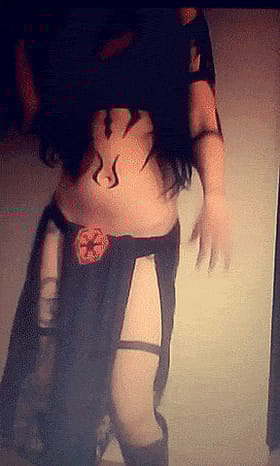 Teen Selfshot: Hot Chick in Black Dress with Tattoo and Fire Symbol'