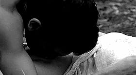 Chupando - Man Sucking on Woman's Breast'