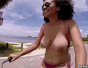 Big Tits Ebony Babe Riding Bicycle in Public with Sunglasses'