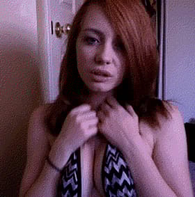 Redheaded Babe in Black and White Bikini'