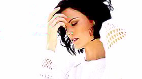 Celebrity Sexy: Black Hair, White Shirt, and a Finger in Her Mouth'
