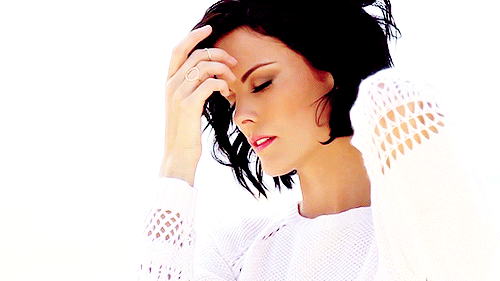Celebrity Sexy: Black Hair, White Shirt, and a Finger in Her Mouth picture 1 of 1