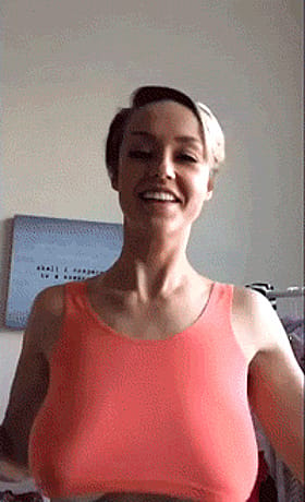 Big Tits GIF: Smiling Busty Babe in Pink'