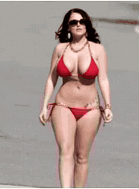 Sexy Babe in Red Bikini Walking on the Beach'