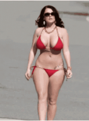 Sexy Babe in Red Bikini Walking on the Beach picture 1 of 1